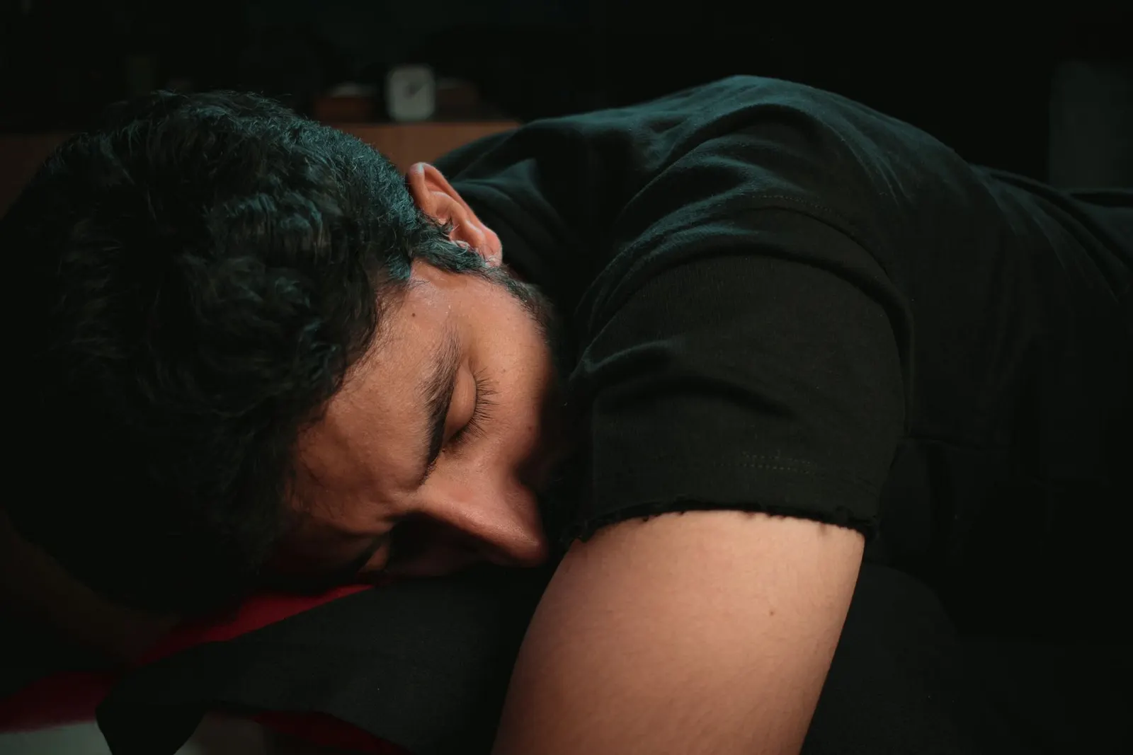 Young man sleeping peacefully with his eyes closed